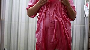 indonesian girl bathes wearing transparent satin dress