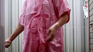 indonesian girl bathes wearing transparent satin dress