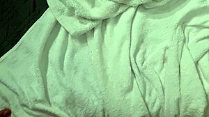 Man in towel strokes hard with close up finish