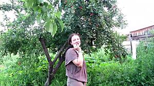 Milf pissed in jeans in public garden outdoors